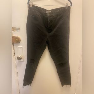 Black ripped button through jeans